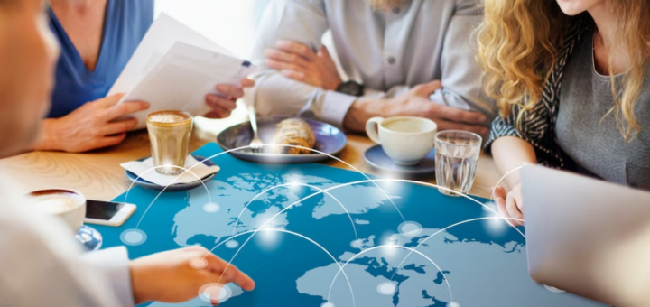 people sitting near the big globe with coffee and water, lines connecting continents