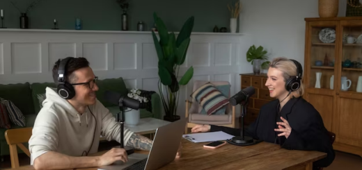 A man and a woman recording a podcast