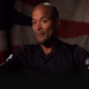 David Goggins with a flag-themed backdrop