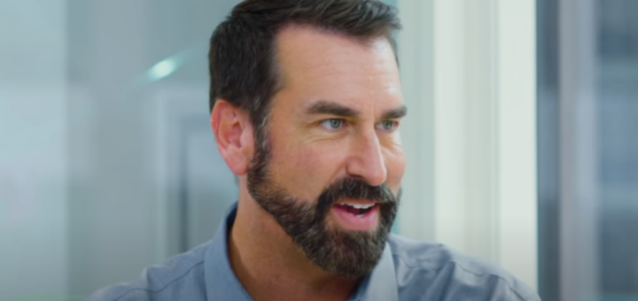 Rob Riggle with a smiling expression