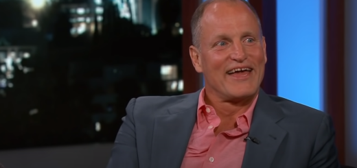 Picture of a smiling Woody Harrelson in a suit
