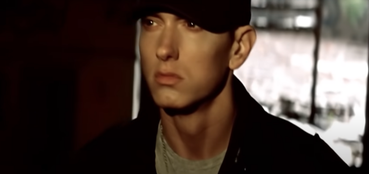 eminem in black hat looking forward