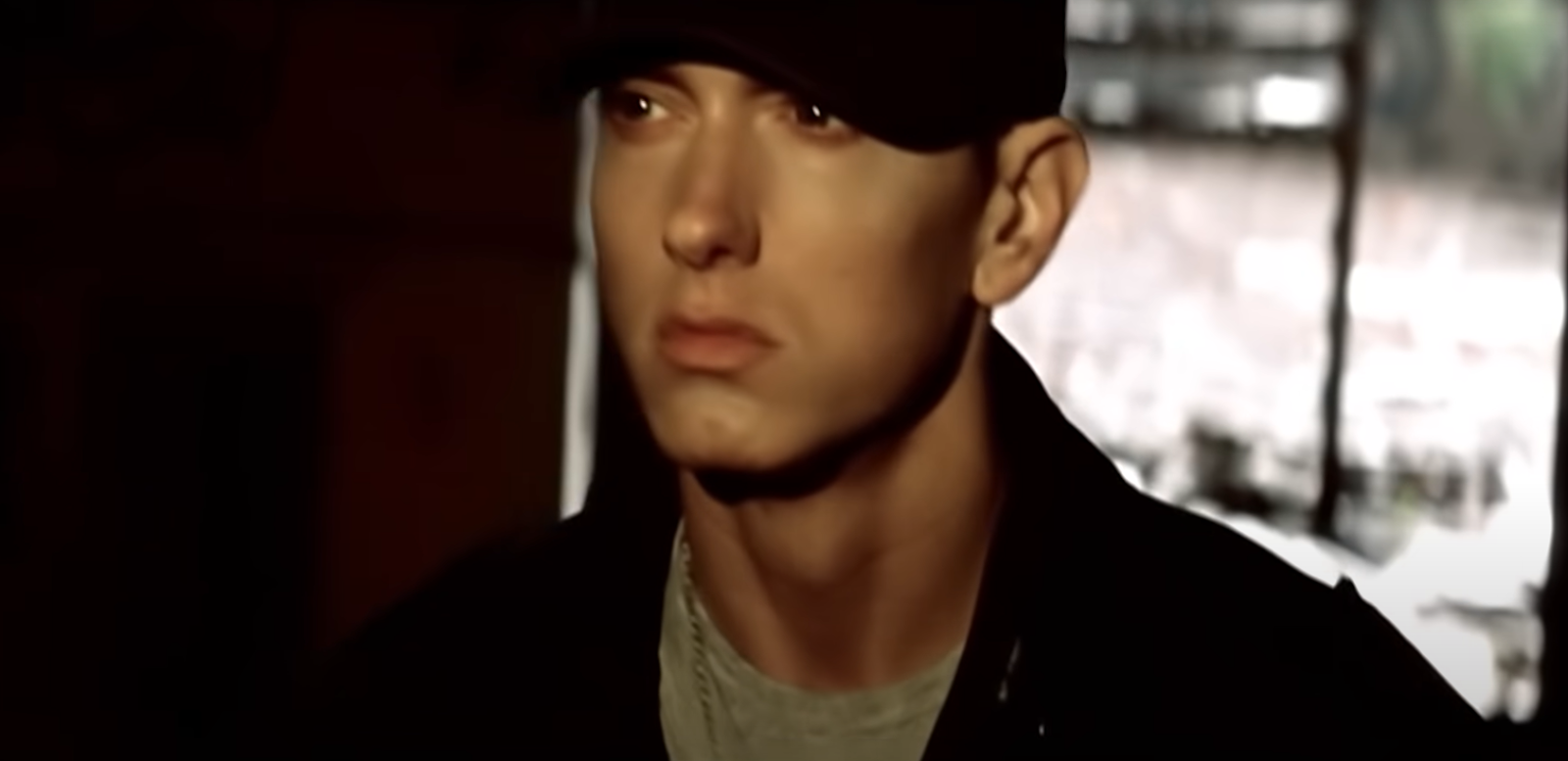 eminem in black hat looking forward