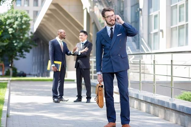 Man in a suit talking on the phone