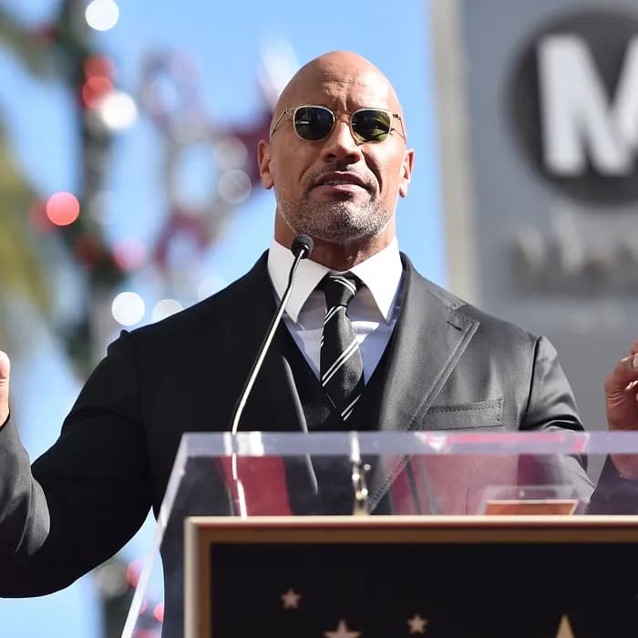 Dwayne Johnson speaking on the podium