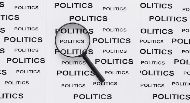 The magnifying glass lies in the word politics