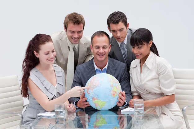 Business team holding a globe